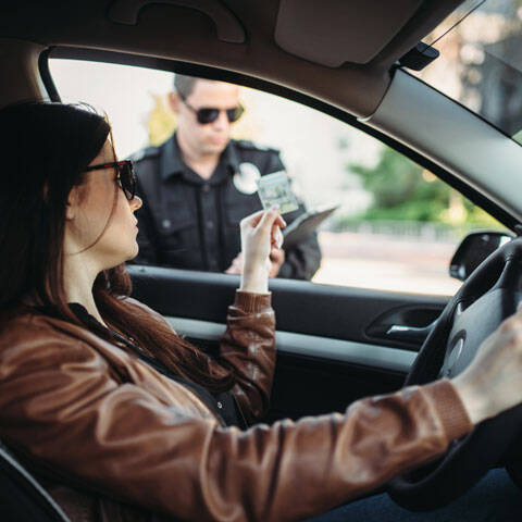 Peters Law Woman Showing License to Police During Traffic Stop